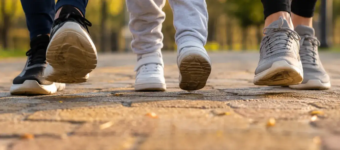 People walking outdoors in athletic shoes